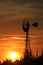 Kansas Windmill at Sunset with a colorful sky with the Sun