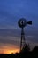 Kansas Windmill at Sunset with a colorful sky with the Sun
