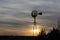 Kansas Windmill at Sunset with a colorful sky with the Sun