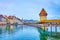 Kapellbrucke bridge and Wasserturm tower are the medieval architectural pearls of old town, on March 30 in Lucerne, Switzerland