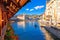 Kapellbrucke historic wooden bridge in Luzern and waterfront landmarks dawn view