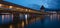 KapellbrÃ¼cke, medieval bridge in Luzern at night. The bridge is illuminated, the lights are reflected in the lake