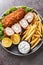 Karadjordjeva Schnitzel is a pork roll stuffed with Kaymak, breaded and fried, served with french fries and tartar sauce close-up