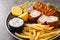Karadjordjeva steak deep fried rolled veal or pork schnitzel served with fried potatoes with french fries and tartar sauce close-