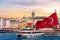 Karakoy pier, a ferry, Turkish flag and the Galata Tower in the background, Istanbul, Turkey