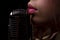 Karaoke. Closeup lip with vintage microphone. Sensual woman singer. Concert singing.