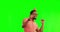 Karaoke, dance and man with microphone by green screen in studio with party hat and sunglasses. Happy, celebration and