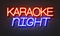 Karaoke night neon sign on brick wall background.