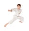 Karate boy in white kimono jumping isolated