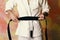 The karate fighter with black belt. Japanese karate training and sports concept.