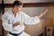 Karate Fighter practises fight in martial arts gym