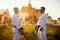 Karate fighters in kimono against ancient temple