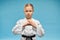 Karate girl with black belt practicing hands position.