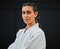 . Karate, judo or taekwondo woman in white kimono for martial arts, jiu jitsu and kung fu against a black studio