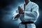 Karate martial arts fighter on dark background