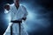 Karate martial arts fighter on dark background