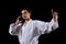 Karate martial sport with young boy in kimono, black background, fight