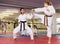 Karate trainer sparring with her student