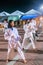 Karate training for teenage Filipina girls,practicing in the open air at night,on Rizal Boulevard