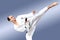 In karategi sportsman beats roundhouse kick