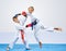 In karategi two karateka are training punch arm and block