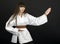 Karateka asian girl on black background studio shot