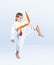 Karateka girl beats a kick leg forward