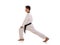 Karateka guy bend knee warm-up side view isolated
