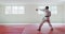 Karateka walking and kicking in the air