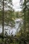 Karelian Forest, River and Little Waterfall with Cloudy Sky