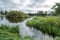 Karelian Lake in the Morning, River Channel, Grass and Trees