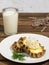 Karelian Pirakka pies located on a white plate. Near a glass of milk, a branch of lavender. Traditional dish of Karelia and