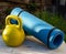 Karemat and kettlebell on a wooden table