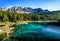 Karersee Lago di Carezza, is a lake in the Dolomites in South Tyrol, Italy. In the background the mountain range of the Latemar