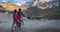 Kargil, India - June 18 2019: Two young local kashmiri boys of Kargil riding on a bicycle during sunset