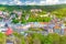 Karlovy Vary Carlsbad historical city centre top aerial view with colorful beautiful buildings, Slavkov Forest