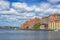 KARLSKRONA, SWEDEN - 2017 July. Typical red Swedish wooden houses with natiaonal flag in the city of Karlskrona