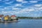 KARLSKRONA, SWEDEN - 2017 July. Typical red Swedish wooden houses with natiaonal flag in the city of Karlskrona