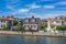 KARLSKRONA, SWEDEN - 2017 July. Typical red Swedish wooden houses with natiaonal flag in the city of Karlskrona