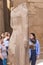 Karnak Temple, complex of Amun-Re. People are viewing the statue.