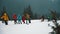 KARPATY, HOVERLA, UKRAINE. A group of tourists with backpacks and raincoats climbs the mountain in the snow. Heavy