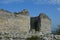 Karst areas where all the walls are built of limestone. a castle from the Middle Ages destroyed with a collapsed orvor in the wall