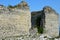 Karst areas where all the walls are built of limestone. a castle from the Middle Ages destroyed with a collapsed orvor in the wall