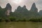 Karst mountains seem to be set in rain forest along Li River in Guilin, China