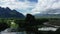 A karst peak and mountains in the green countryside