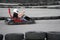 Kart crossing the finish line action, speed, helmet, track, driver, competition, motor, motion, adrenalin