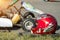 Karting competitions, a red protective helmet lies against the background of the racing carting, close-up