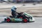 Karting - driver in helmet on kart circuit