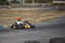 Karting - driver in helmet on kart circuit