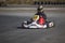 Karting - driver in helmet on kart circuit